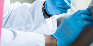 DOES INFLUENZA VACCINATION OF HEALTHCARE WORKERS PREVENT TRANSMISSION WITHIN CARE HOMES?